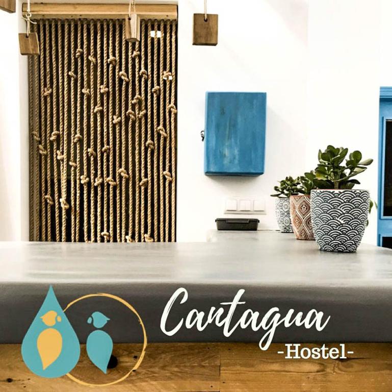 a table with a sign that says cartagena hospital at Cantagua Hostel in Valencia