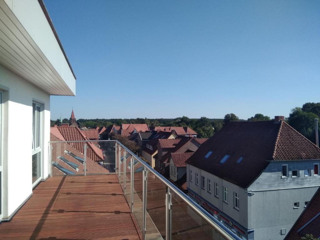 a balcony with a view of a city at Hotel Walsroder Hof in Walsrode