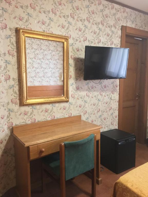 TV a/nebo společenská místnost v ubytování Hotel Sporting