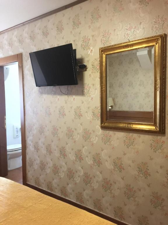 TV a/nebo společenská místnost v ubytování Hotel Sporting