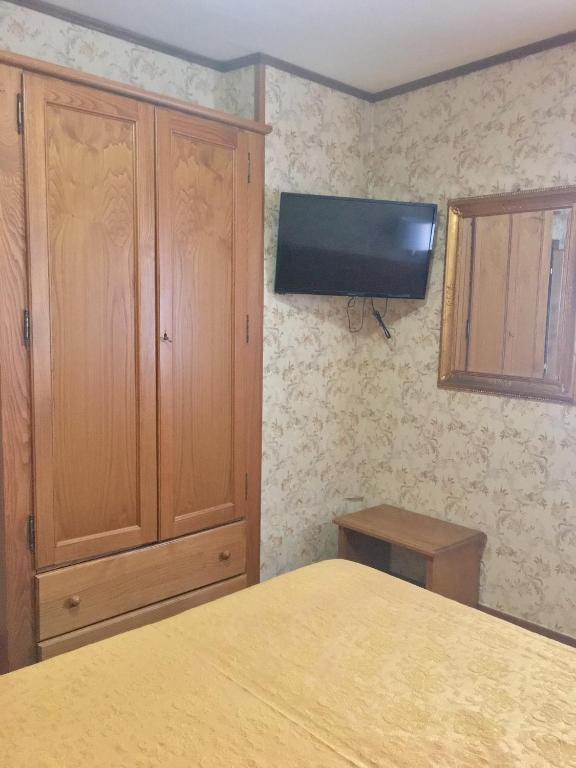 TV a/nebo společenská místnost v ubytování Hotel Sporting