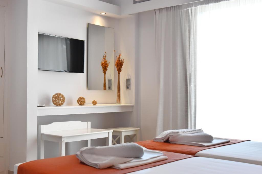 Un ou plusieurs lits dans un hébergement de l'établissement Hotel Korali