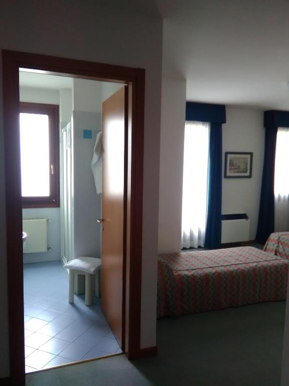 Postel nebo postele na pokoji v ubytování Hotel Naonis