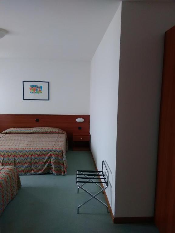 Postel nebo postele na pokoji v ubytování Hotel Naonis