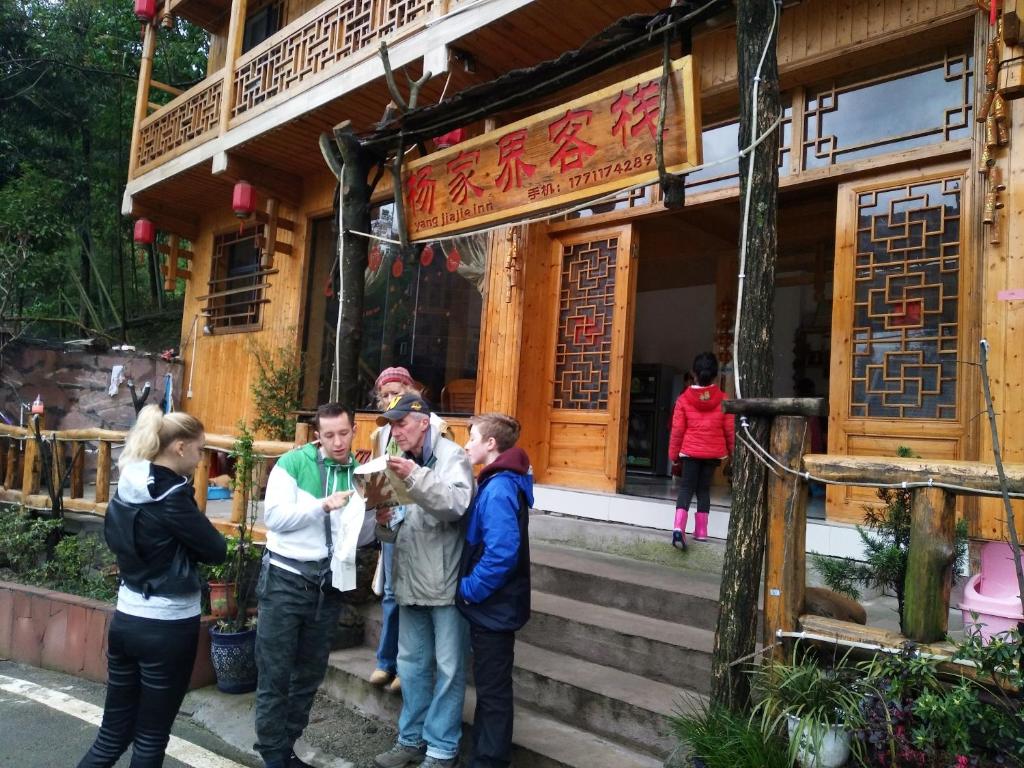 a group of people standing outside of a building at Yangjiajie Inn in Zhangjiajie