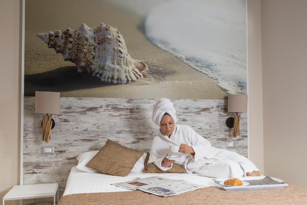 Postel nebo postele na pokoji v ubytování Hotel Life
