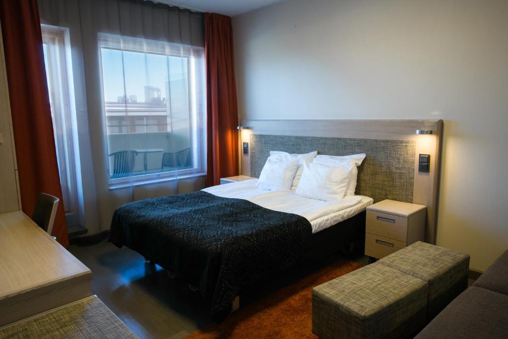 Postel nebo postele na pokoji v ubytování Original Sokos Hotel Vaakuna Joensuu