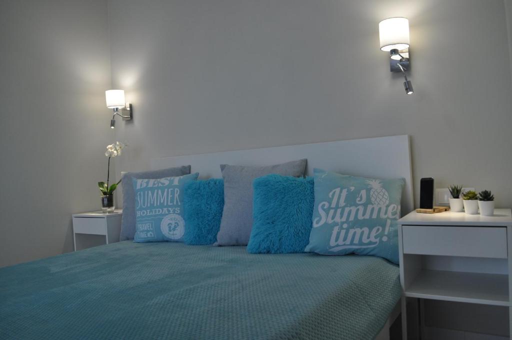 Postel nebo postele na pokoji v ubytování Apartamenty Feniks & Pegaz