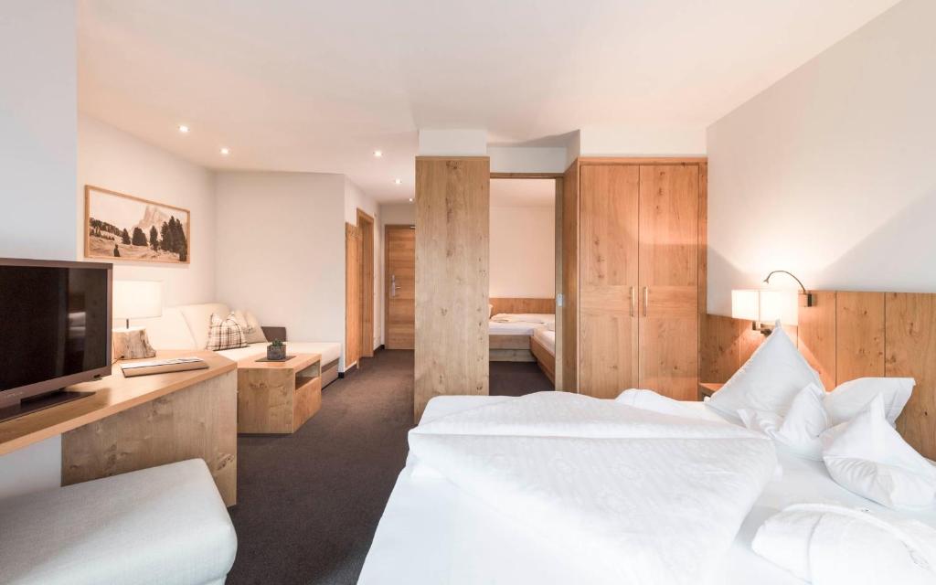 Postel nebo postele na pokoji v ubytování Hotel Gasserhof
