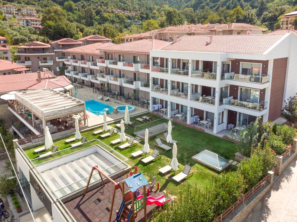 an aerial view of a resort with a swimming pool at Ntinas Filoxenia Hotel & Spa in Skala Potamias