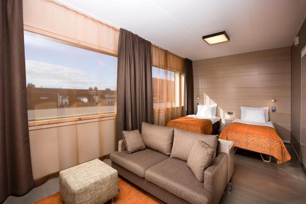 Postel nebo postele na pokoji v ubytování Original Sokos Hotel Vaakuna Joensuu