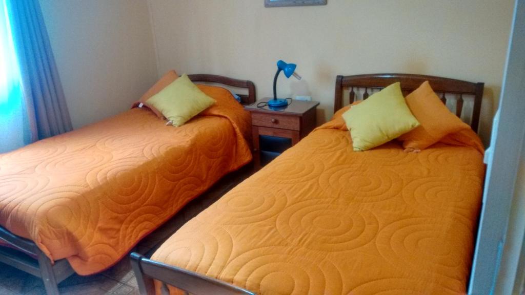 Postel nebo postele na pokoji v ubytování Hostal Miramar