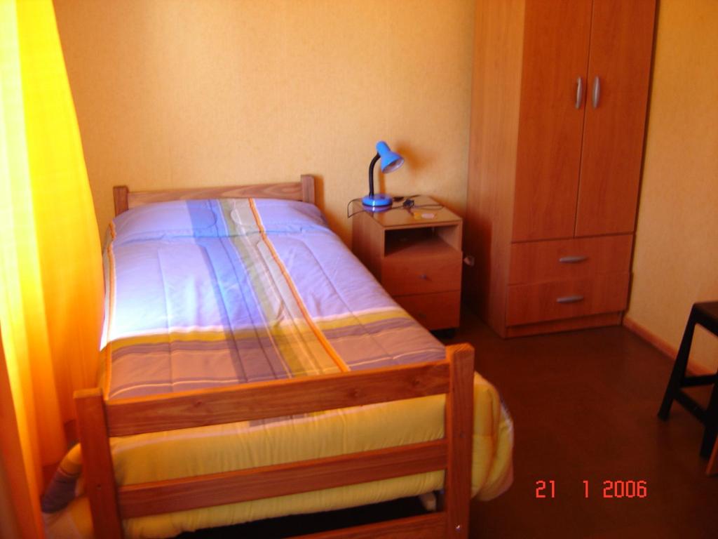 Postel nebo postele na pokoji v ubytování Hostal Miramar