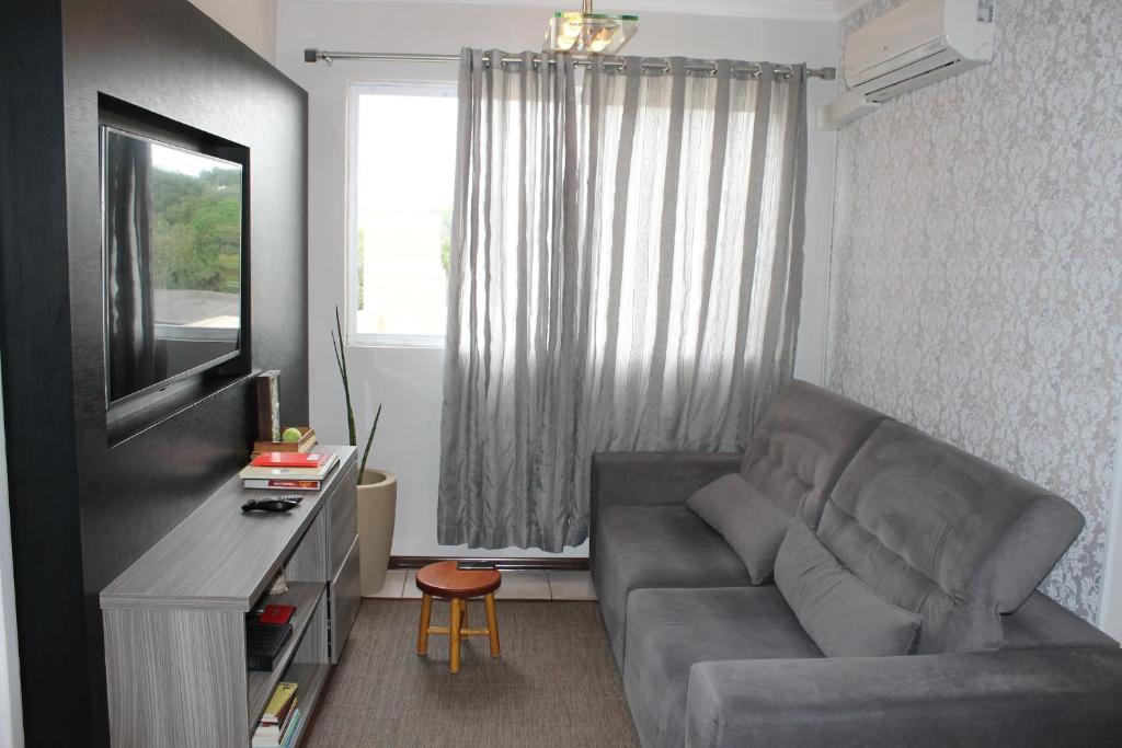 Zona de estar de Apartamento: Acomodação mobiliada e completa