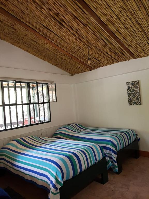 Postel nebo postele na pokoji v ubytování Hacienda Gonzabal