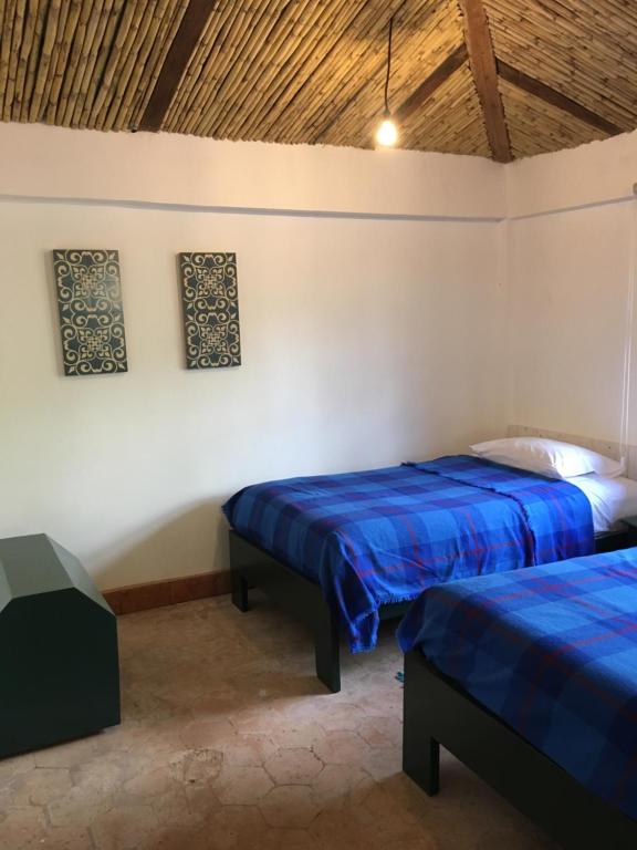 Postel nebo postele na pokoji v ubytování Hacienda Gonzabal