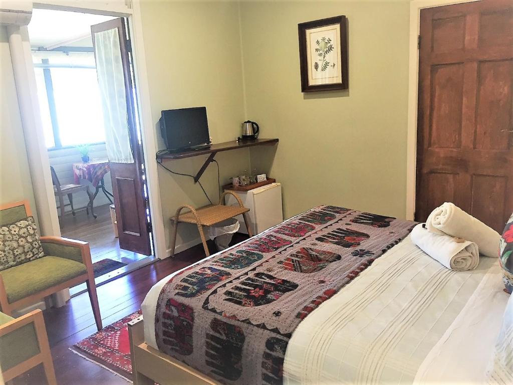 Postel nebo postele na pokoji v ubytování Grey Gum Lodge