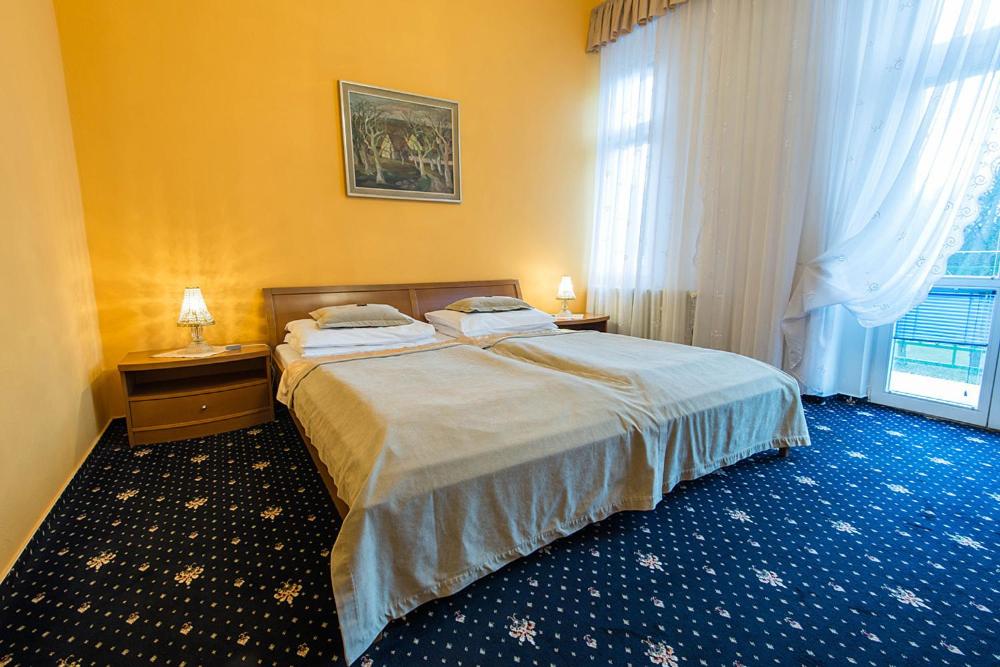 Postel nebo postele na pokoji v ubytování Monti Spa