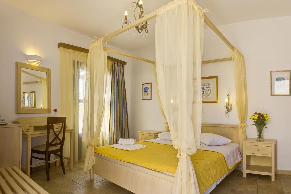 Postel nebo postele na pokoji v ubytování Hotel Mathios