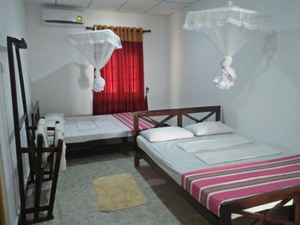 Postel nebo postele na pokoji v ubytování Disna Homestay