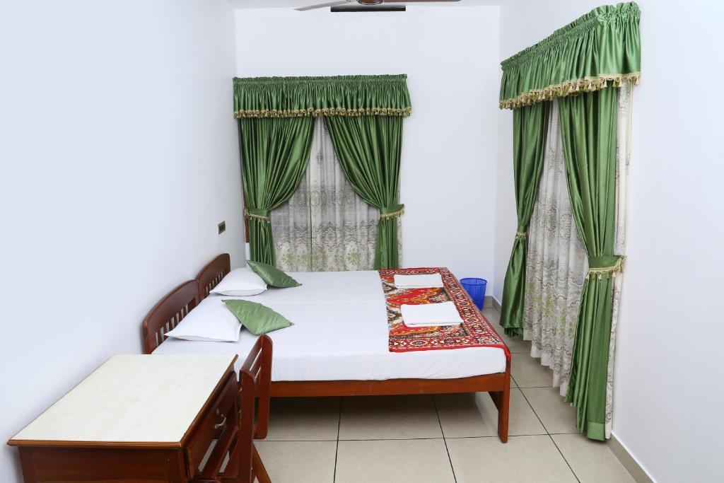 Postel nebo postele na pokoji v ubytování kevins Placid Homestay