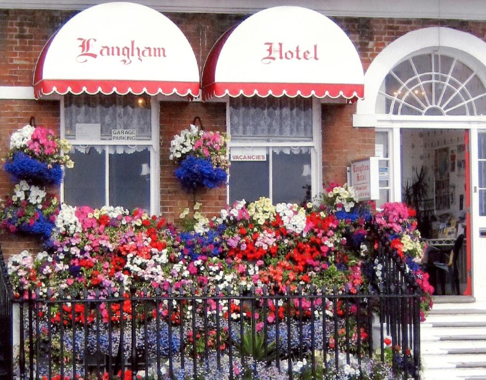 a bunch of flowers in front of a building at The Langham in Weymouth