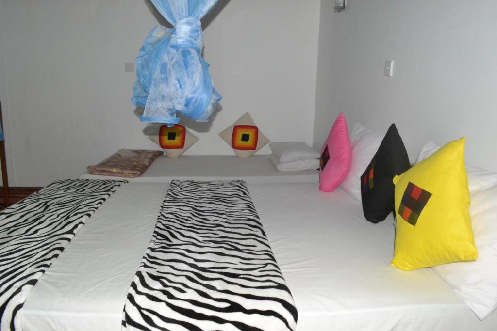 Postel nebo postele na pokoji v ubytování Ella Fresh Point Homestay