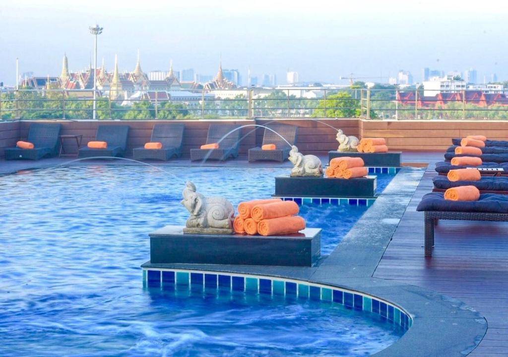 a swimming pool with animals on the top of a building at D&D Inn Khaosan in Bangkok