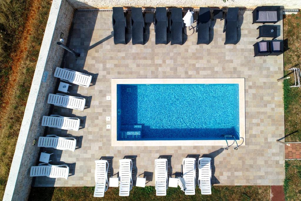 an overhead view of a swimming pool on a house at Apartments Villa Adamović in Umag
