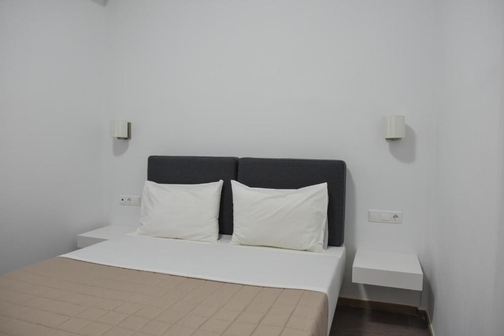 Postel nebo postele na pokoji v ubytování Aestas Apartments