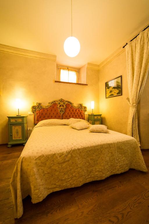 Postel nebo postele na pokoji v ubytování Palazzo Neri