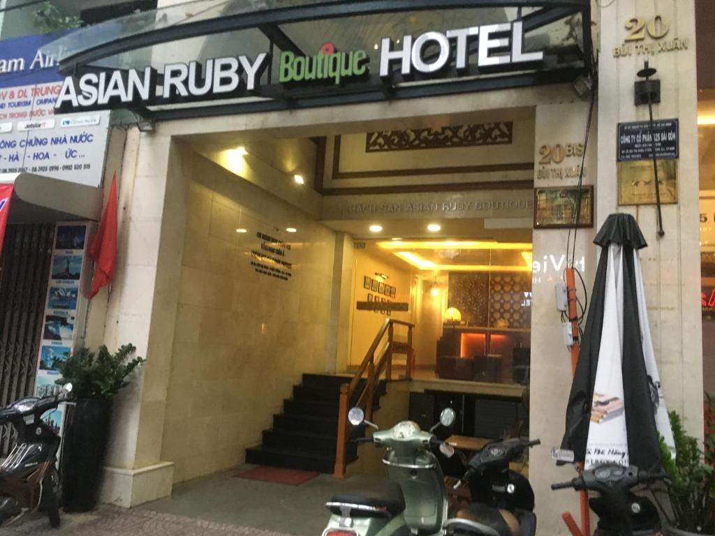 a scooter parked in front of a hotel at Asian Ruby Boutique Hotel Bùi Thị Xuân in Ho Chi Minh City
