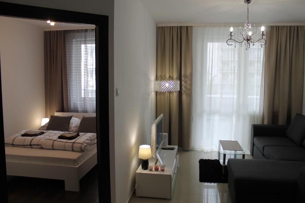 Posteľ alebo postele v izbe v ubytovaní Apartament Antoniukowska 60