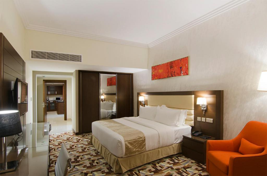 TV a/nebo společenská místnost v ubytování Al Murooj Grand Hotel