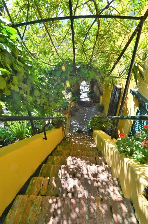a walkway in a garden with plants and trees at Villa Margherita in Levanto