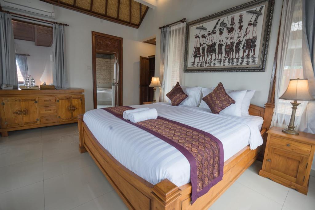 Postel nebo postele na pokoji v ubytování Ketut's Place Cottage Ubud
