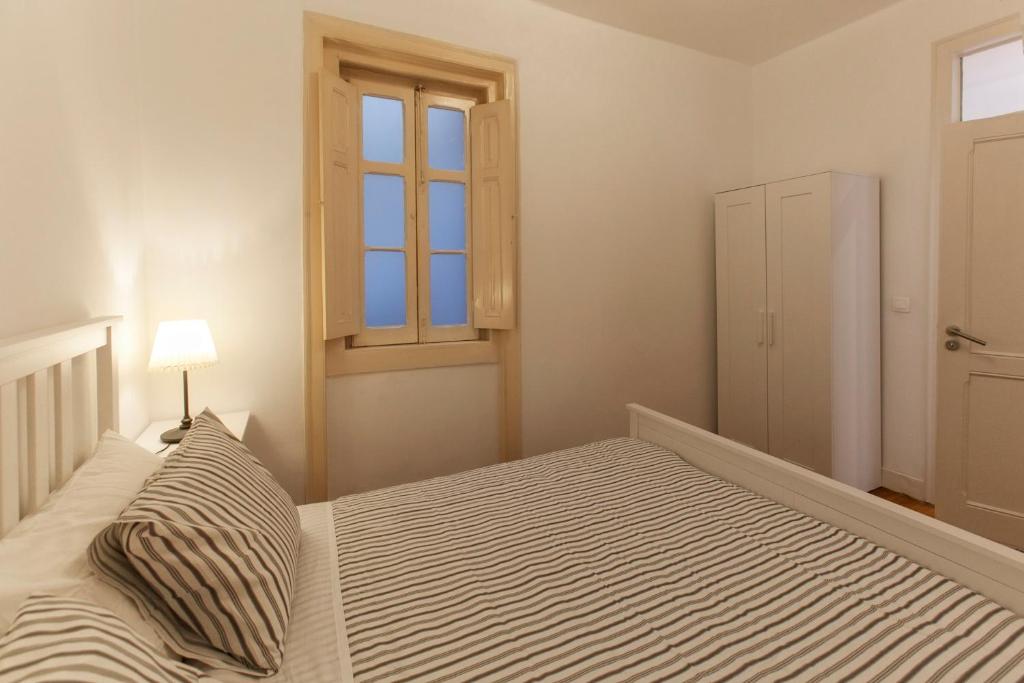 Postel nebo postele na pokoji v ubytování Lisbon City Center Apartment