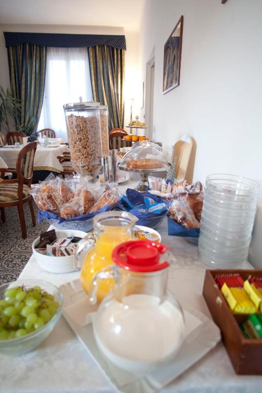 a table with a bunch of food on it at Villa Margherita in Levanto