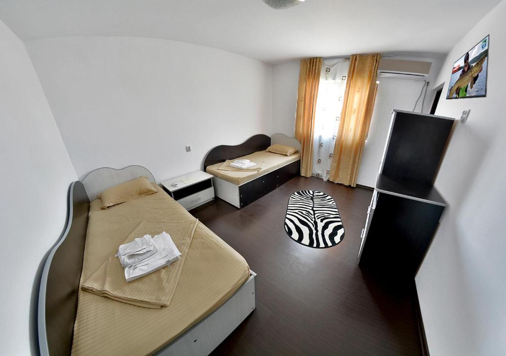 Postel nebo postele na pokoji v ubytování Casa ERIC