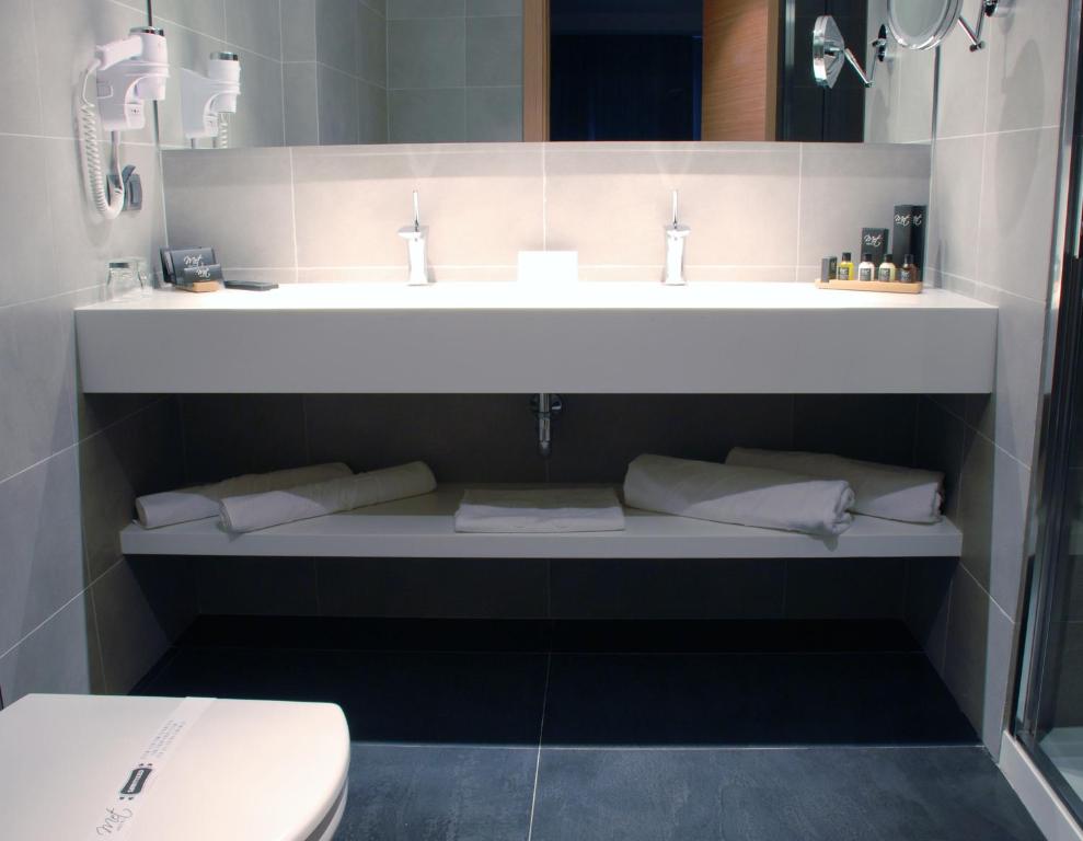 Koupelna v ubytování Met Hotel