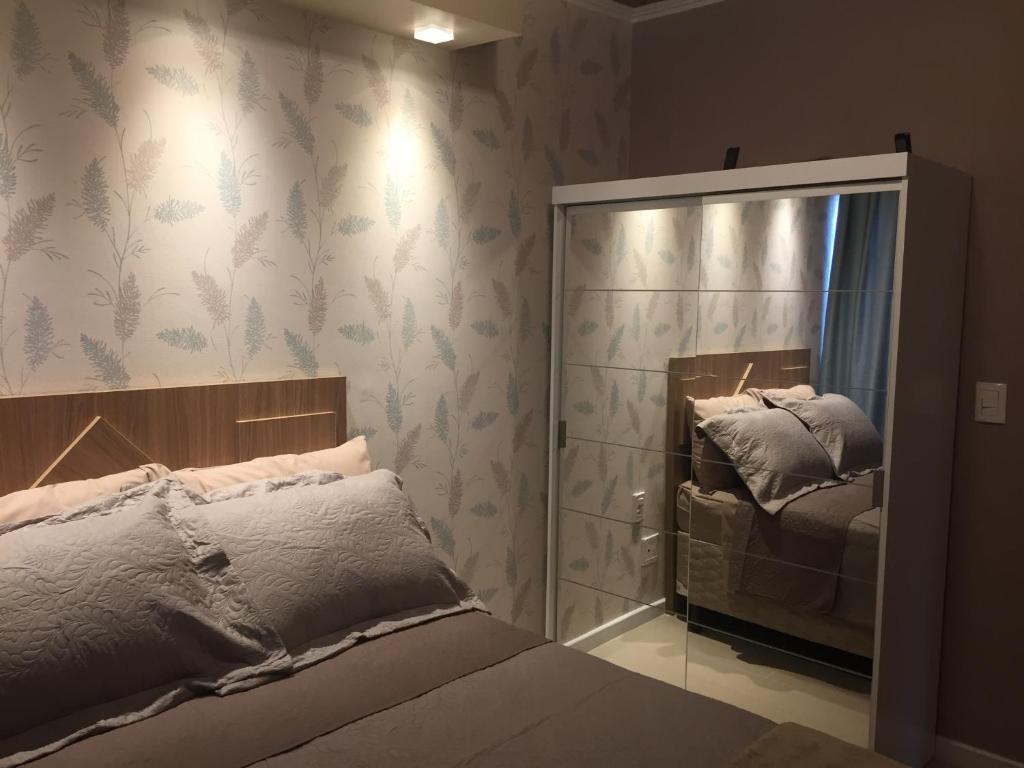 Ένα ή περισσότερα κρεβάτια σε δωμάτιο στο Apartamento em Canela