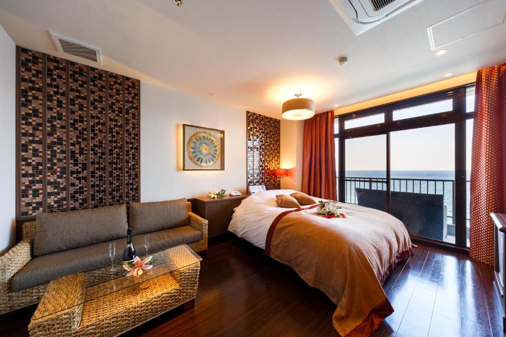 Postel nebo postele na pokoji v ubytování HOTEL MYTH-Resort -ホテル マイス リゾート- adult only