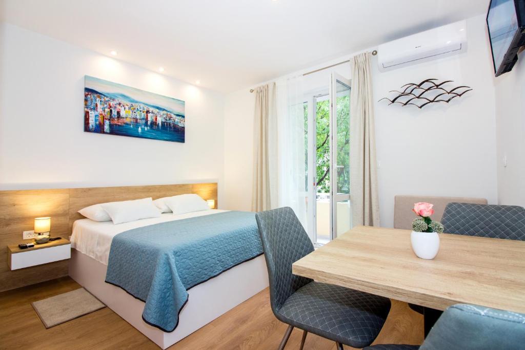 Posteľ alebo postele v izbe v ubytovaní Lugo Apartments