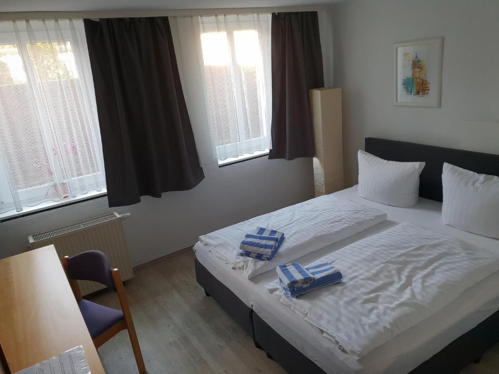Postel nebo postele na pokoji v ubytování Appartement-Hotel Rostock