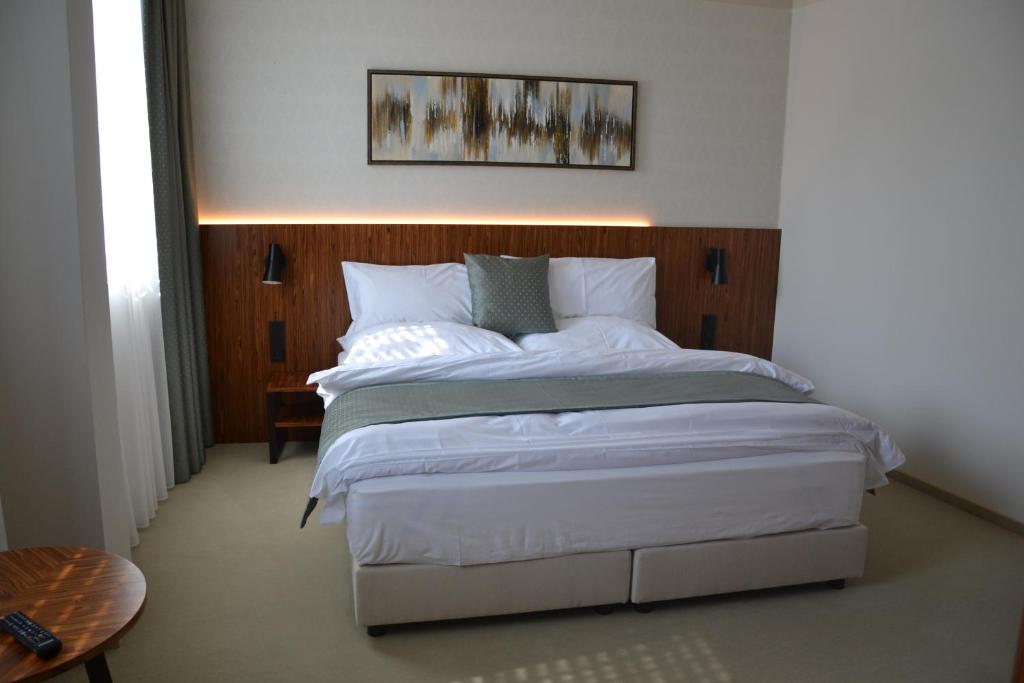 Postel nebo postele na pokoji v ubytování Hotel Rajka