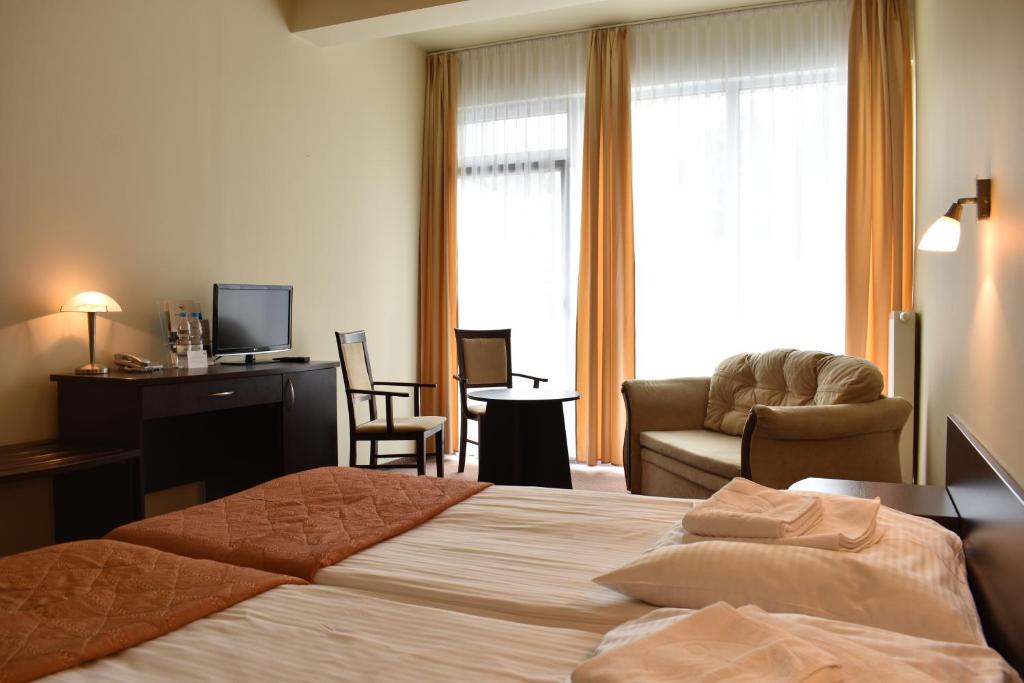 Postel nebo postele na pokoji v ubytování Hotel *** NAT Ustroń