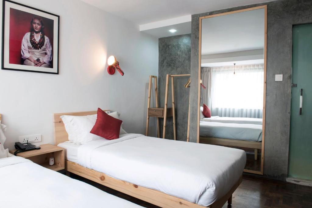 Postel nebo postele na pokoji v ubytování Potala Guest House