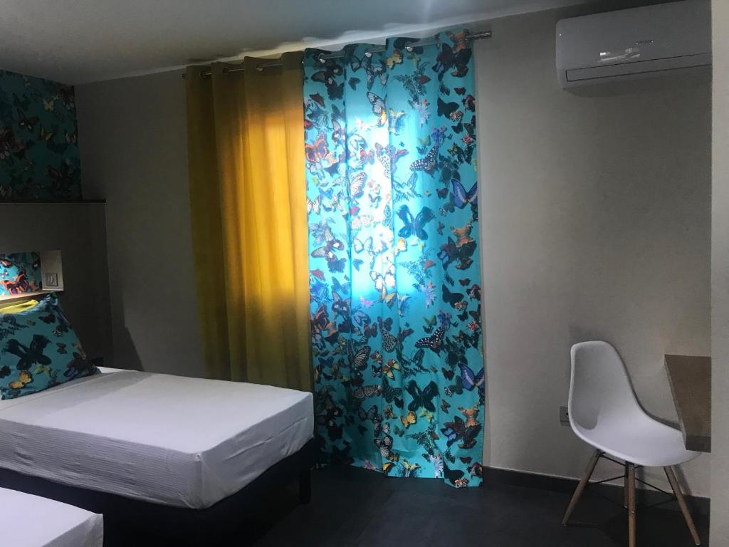 Postel nebo postele na pokoji v ubytování L'Olivine