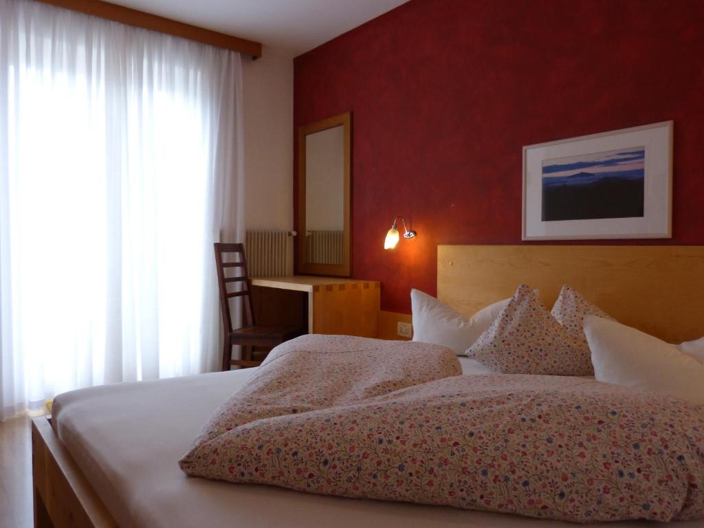 Postel nebo postele na pokoji v ubytování Pension Chalet Andy
