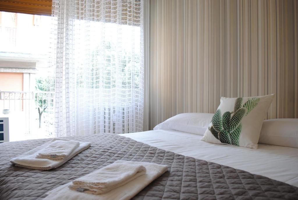 Posteľ alebo postele v izbe v ubytovaní Dreaming Piazza Bra Rooms